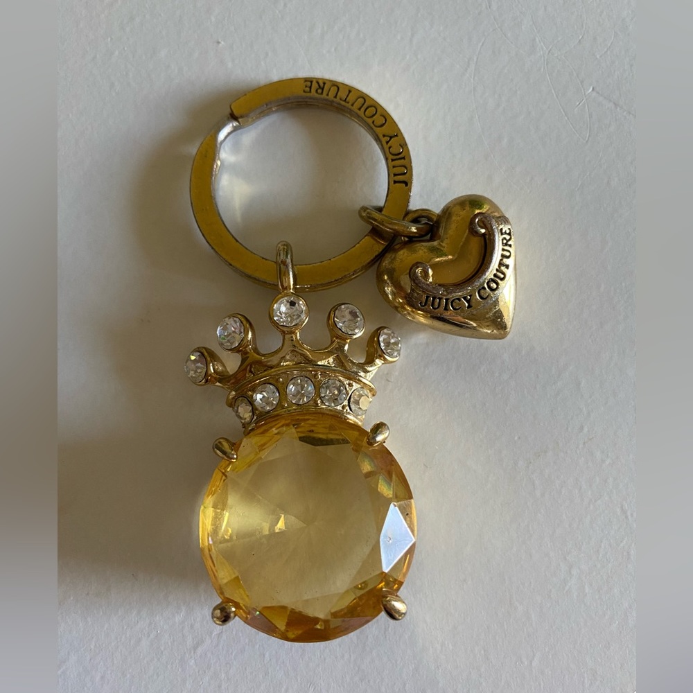 Juicy Couture gold keychain with heart and crown.